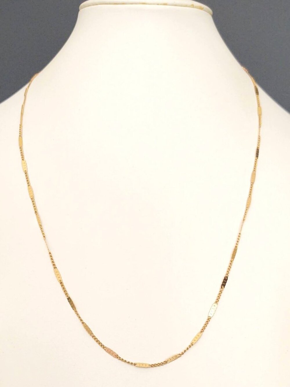 Delicate gold tone chain necklace
